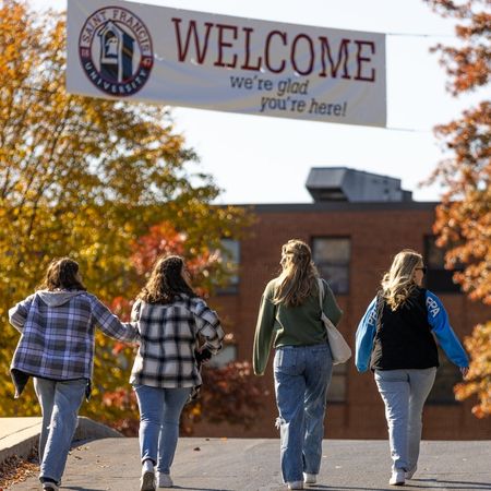 welcome banner with students walking