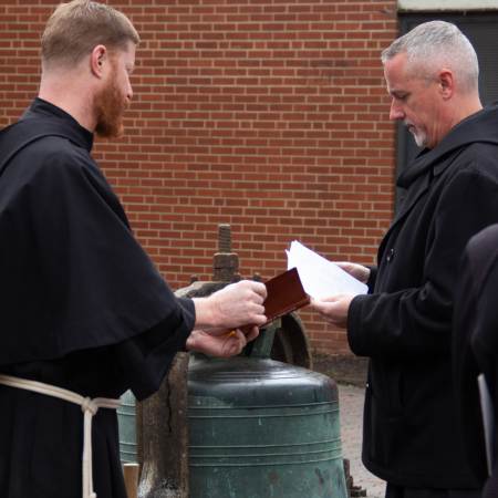Fr. Matthew and Fr. Malachi preparing for bell ringing ceremony