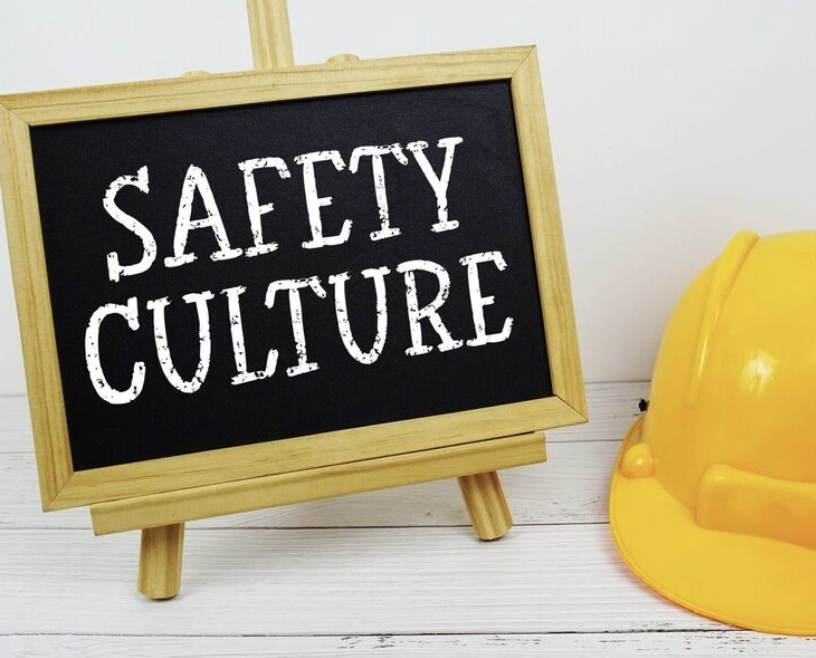 photo of hard hat with a chaulkboard saying safety