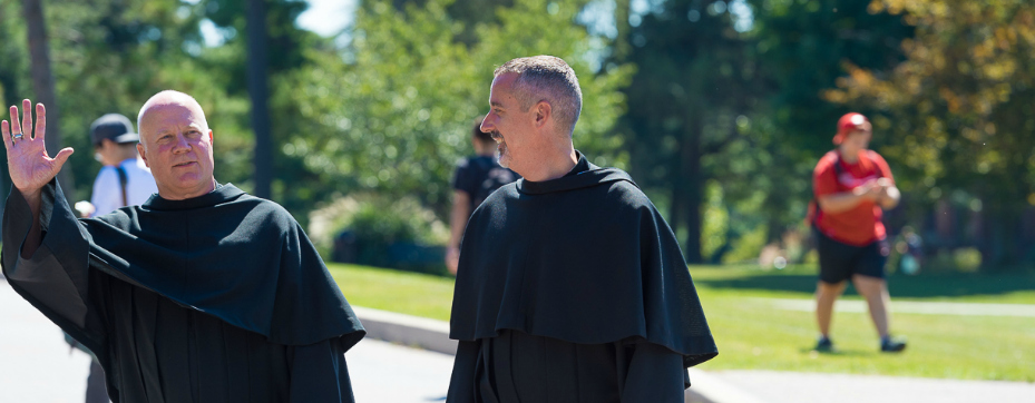 Fr. Lehman and Fr. Malachi walking on campus