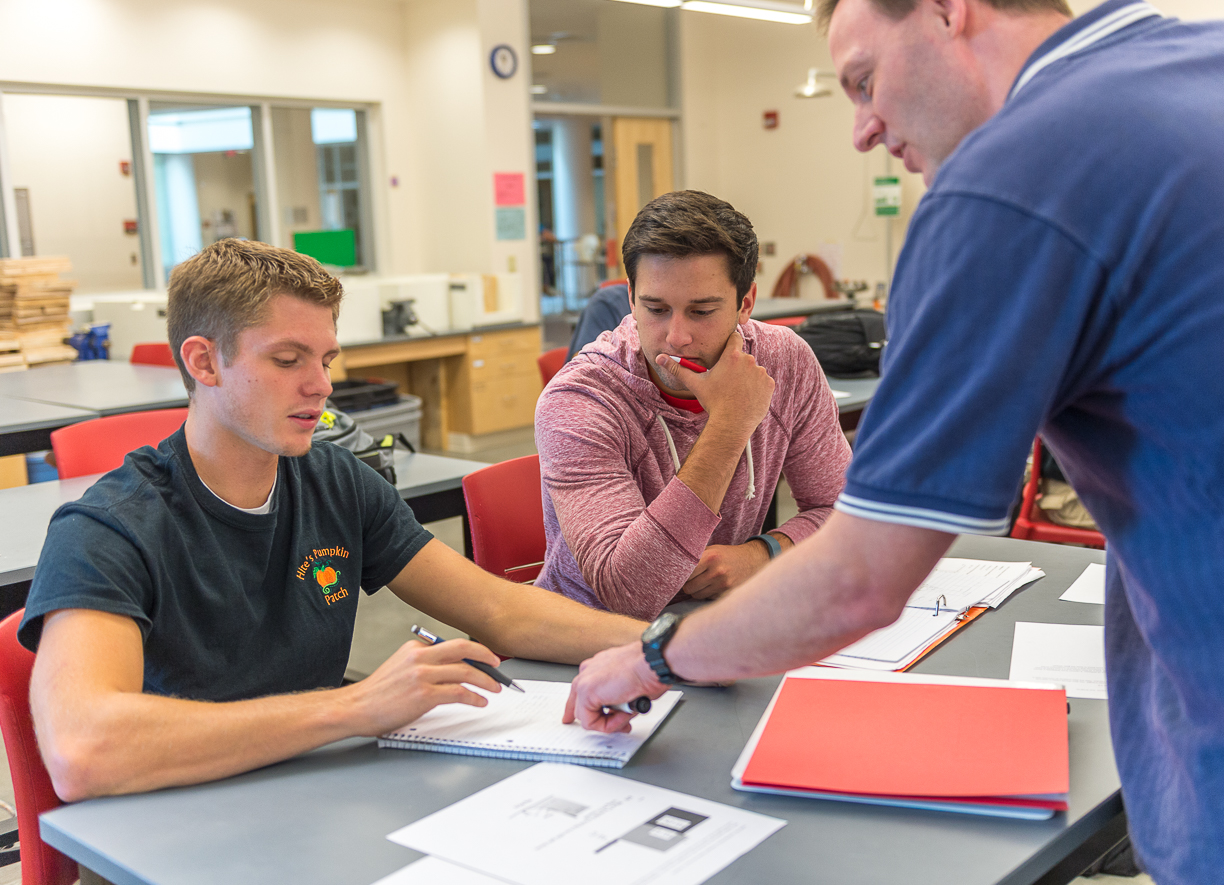 students working with faculty member