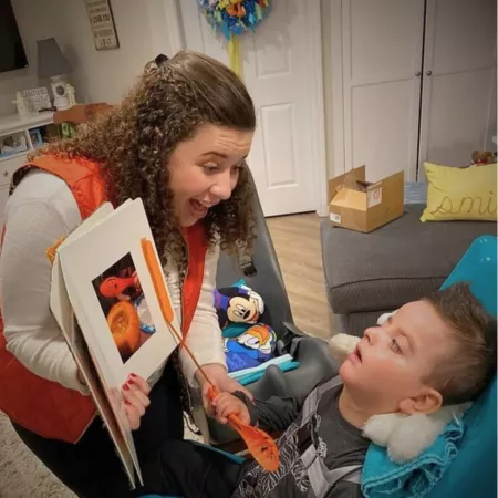 SFU grad in classroom with special ed student