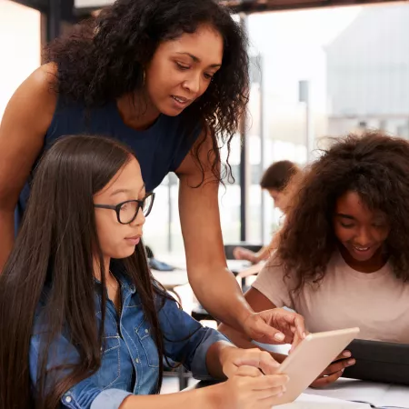 teacher helping students