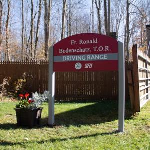 Sign at gate of Fr. Ronald Bodenschatz, T.O.R. Driving Range 