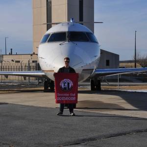 SFU Engineering-Aviation student in front of plane donated by Skywest