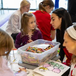 OT student interacts with participant during Baby Day 2025