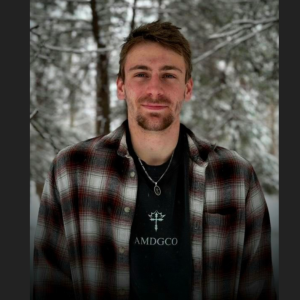 Profile photo of Seth Cunningham wearing his AMDGCO line of clothing