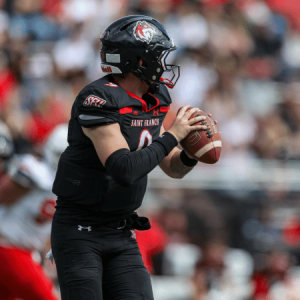 Football Player Saint Francis Red Wolves in front of crowd