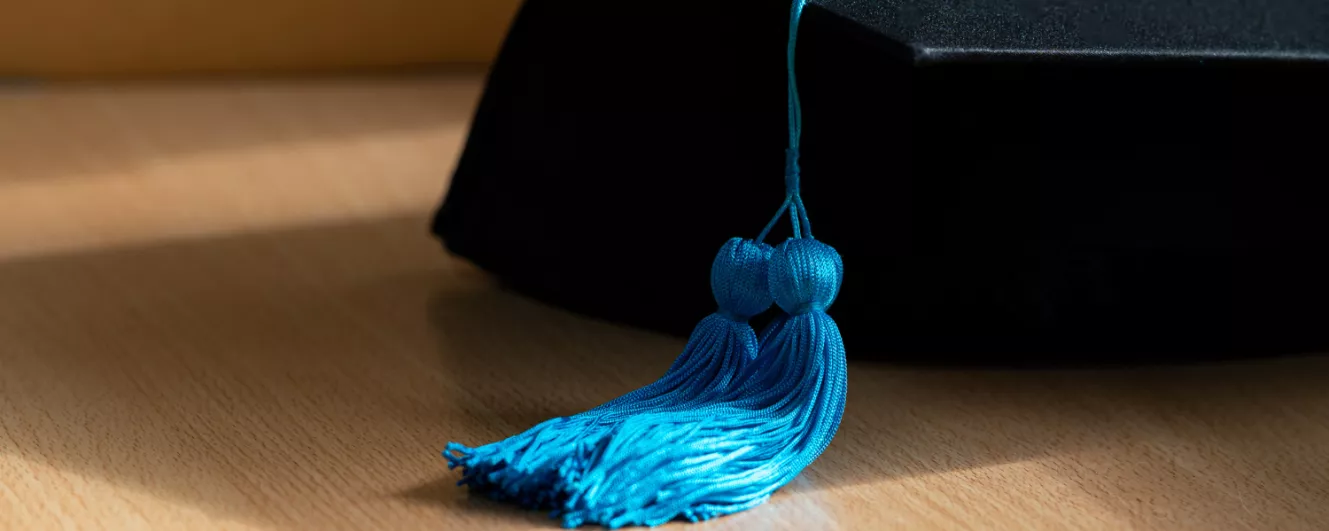 photo of 2 tassels on graduation cap