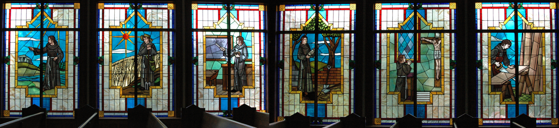stained glass windows of original founding friars at Saint Francis University