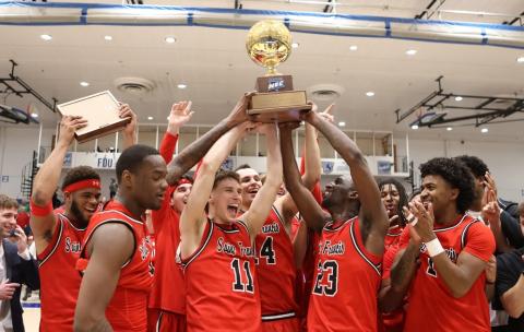 24-25 Mens Basketball Team with NEC trophy