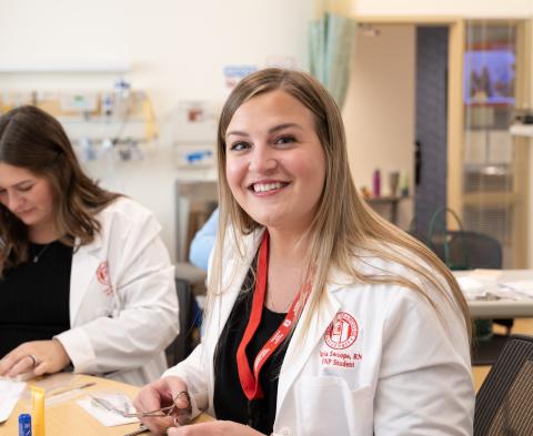 A FNP Student smiles at the camera