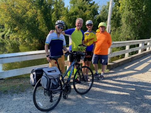 Br. Shamus poses for photo with fellow bikers