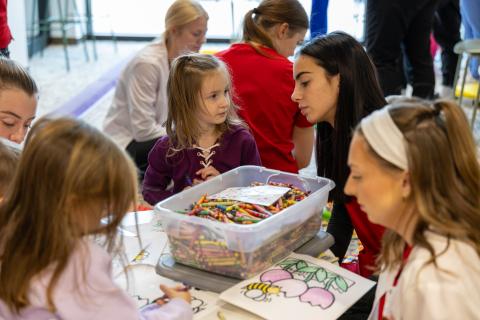 OT student interacts with participant during Baby Day 2025