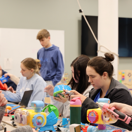OT and Education Students work on making adapted toys to be more inclusive to children with special needs.