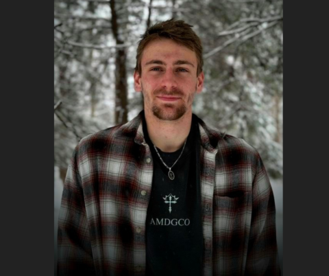 Profile photo of Seth Cunningham wearing his AMDGCO line of clothing