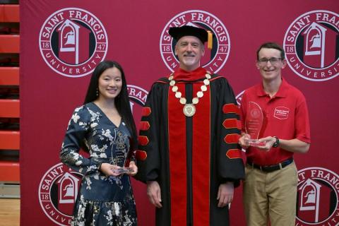 Kaylin Rose, Fr. Malachi Van Tassell, and Matthew Hall at Awards Ceremony