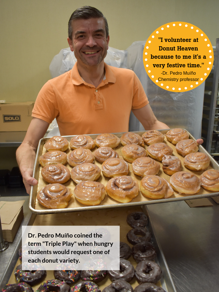 Dr Pedro Muino serving donuts
